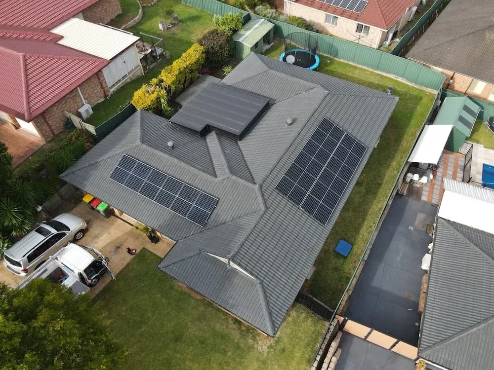 Aerial view of a home with rooftop solar
